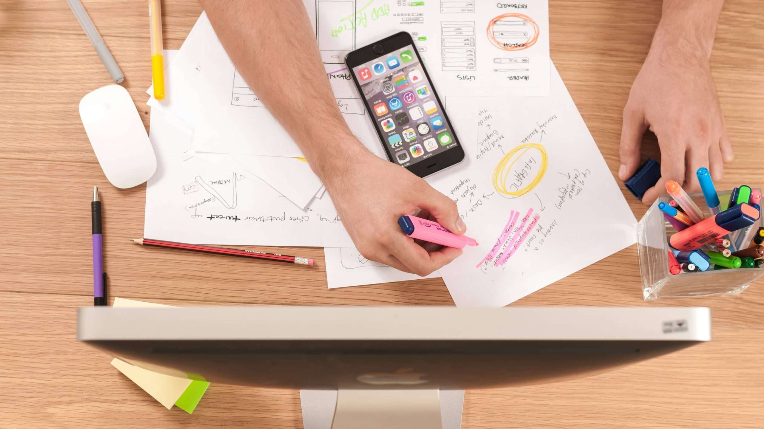 Digital marketing, picture of a mans arm writing out plans for his digital marketing